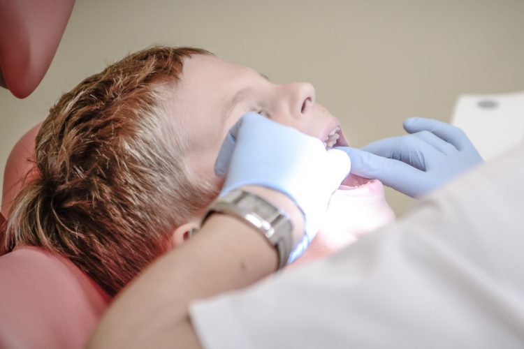 boy receiving dental exam